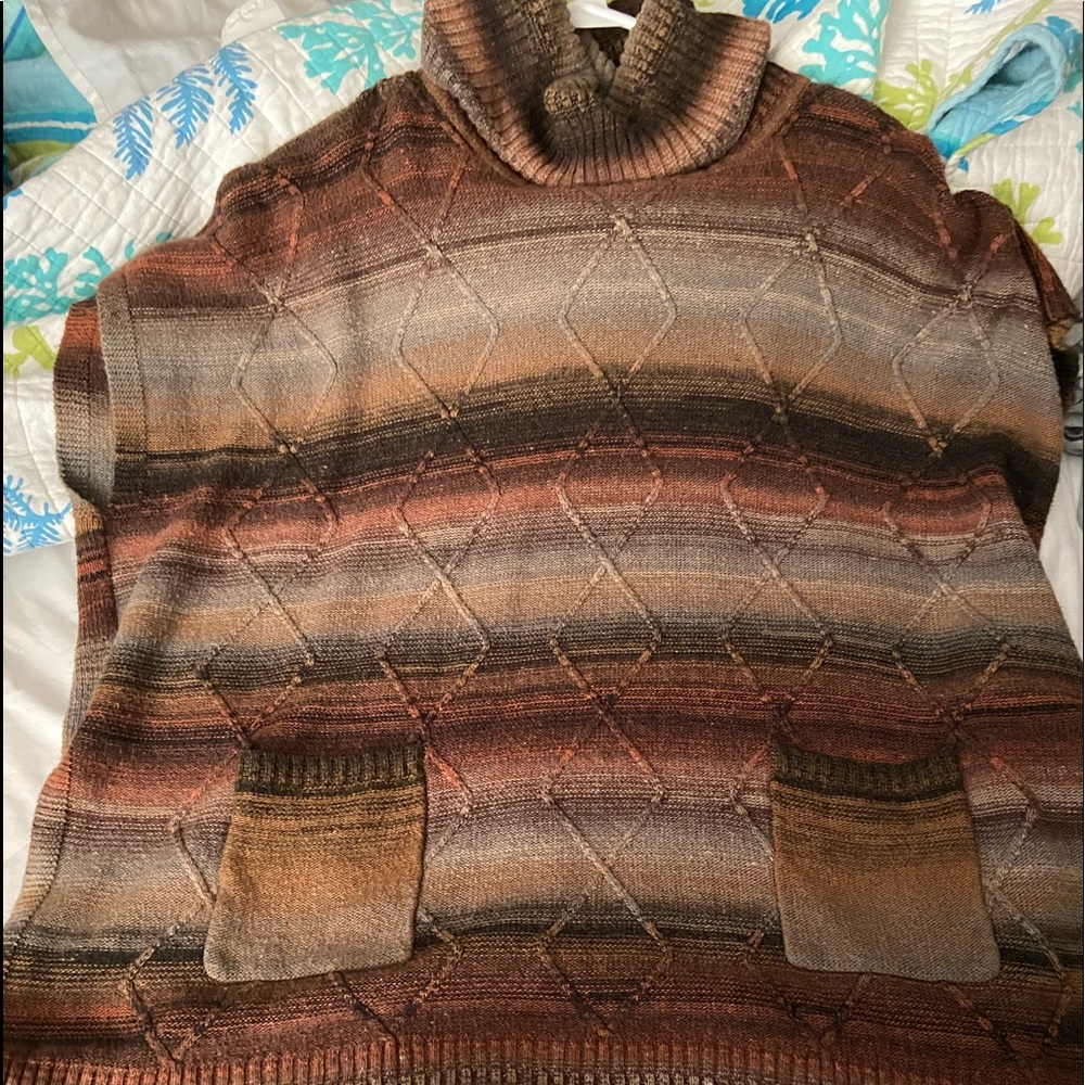Turtleneck poncho.